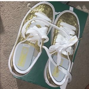 Gold pumas size 6